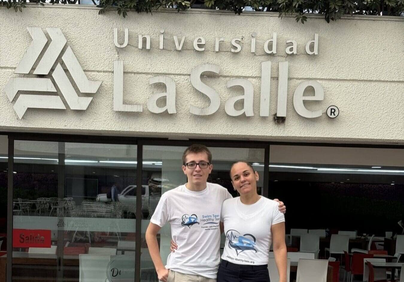 Two people smiling outside La Salle University.